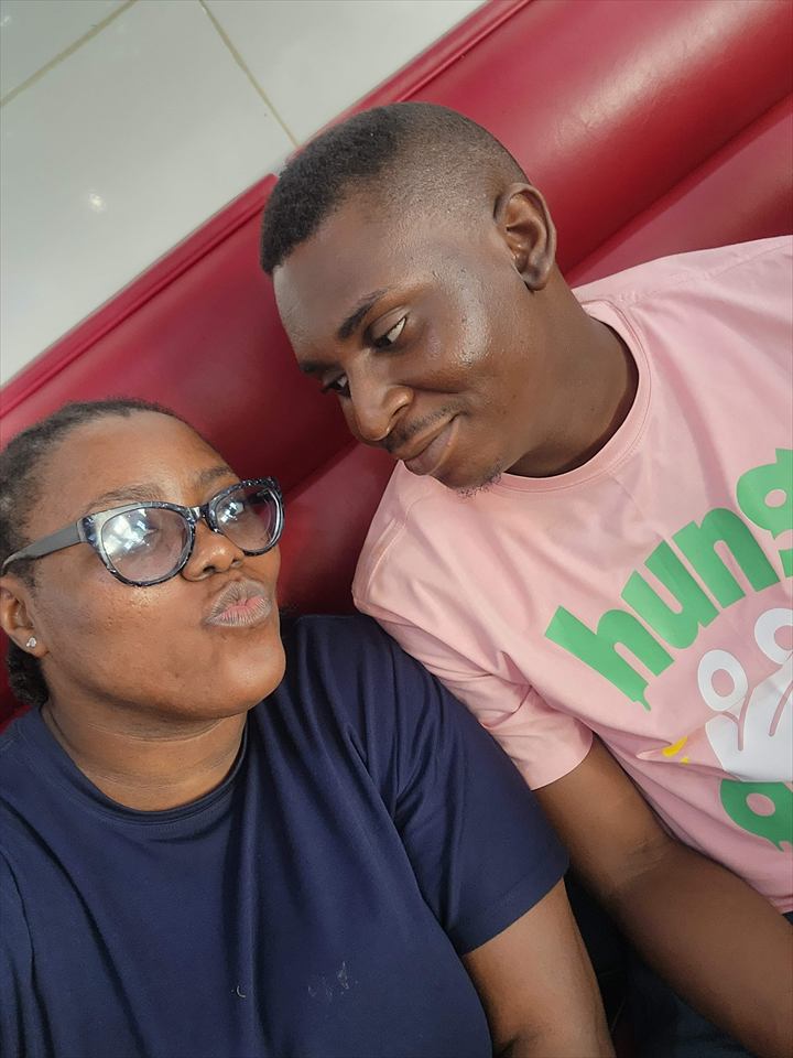 Achi playfully posing beside Osaro in a close selfie