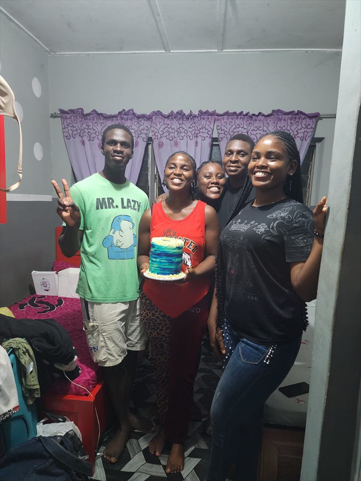 Osaro and Achi celebrating a birthday with family and friends