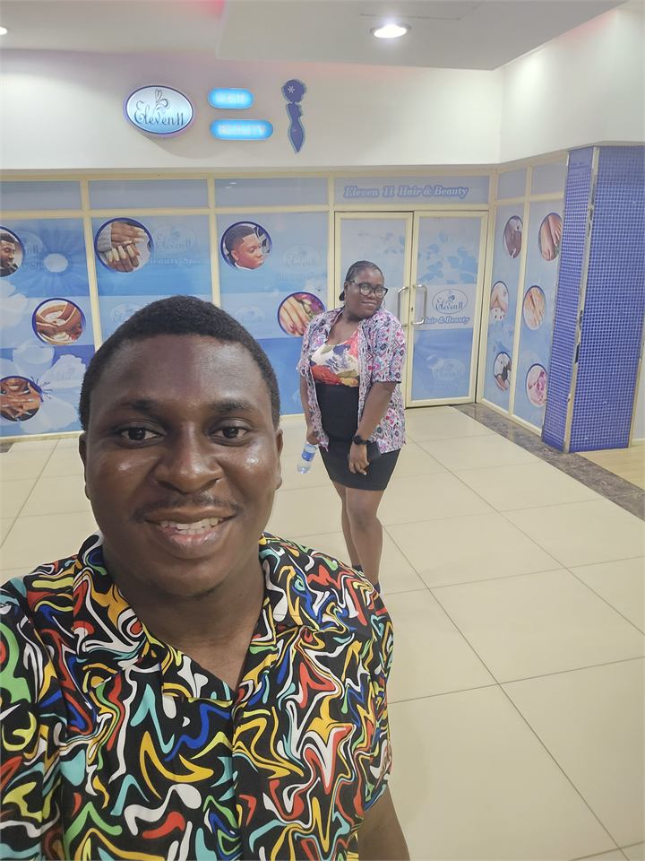 Osaro and Achi taking a selfie during a movie date