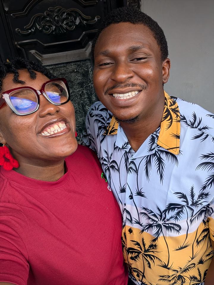 Osaro and Achi laughing together in a bright casual selfie