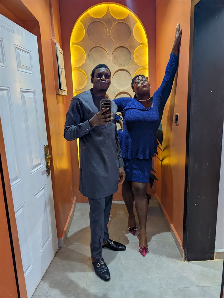 Osaro and Achi dressed for an evening celebration