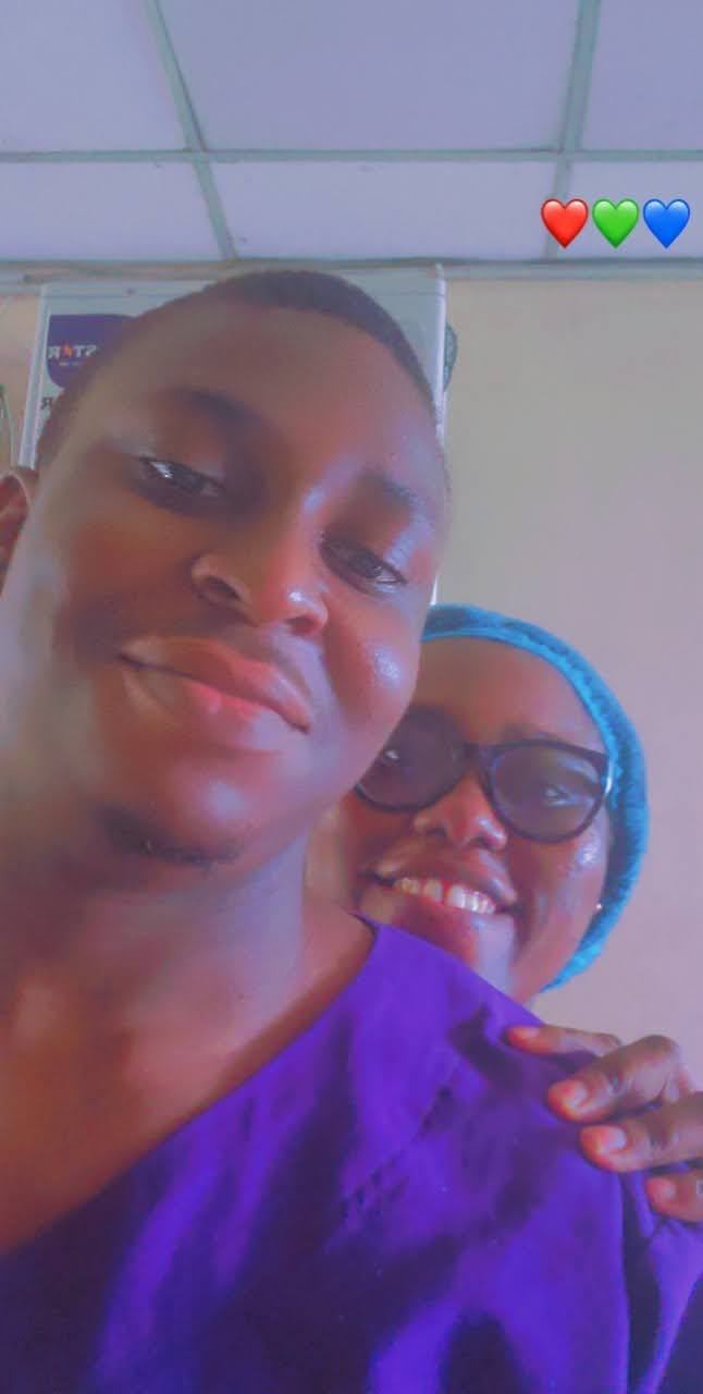 Osaro and Achi smiling together in an early filtered selfie