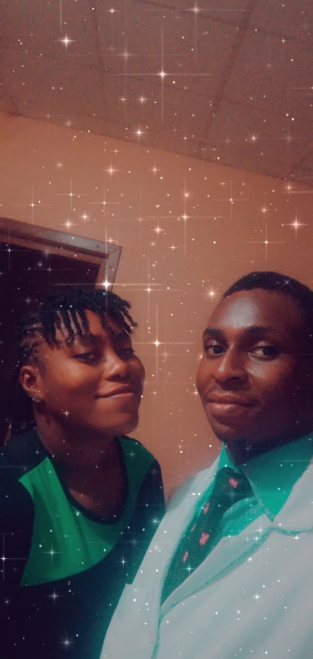 Osaro and Achi in matching green school uniforms in an early selfie